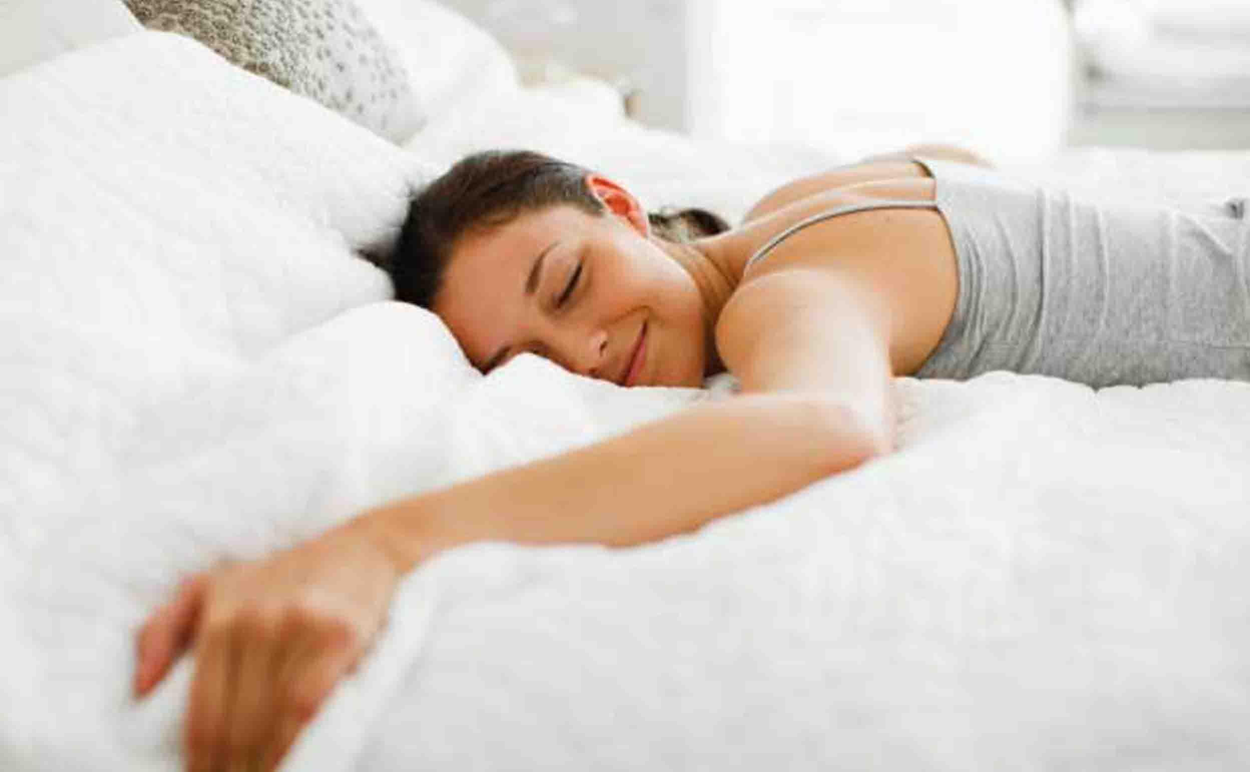 Woman Laying on Freshly Cleaned Duvet